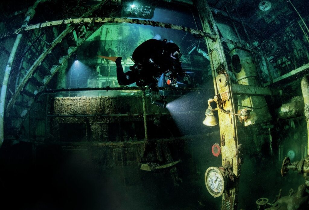 Diver exploring the engine room of the Morrell